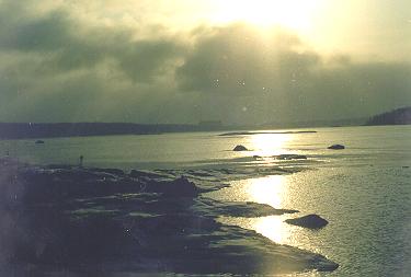 Clouds, rocks and sun reflection